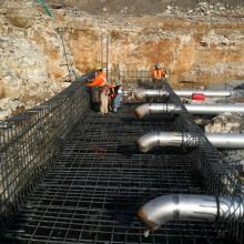 rebar installation for foundation slab featuring large process pipe penetrations