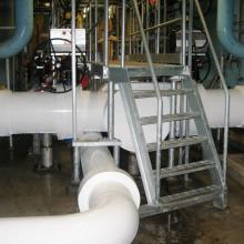 stairway over process piping