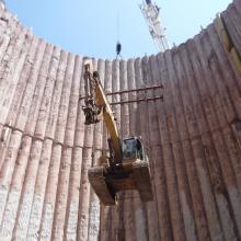 Excavator being craned into the Britannia Pumping Station Foundation
