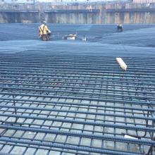 Tying rebar for concrete slab pour